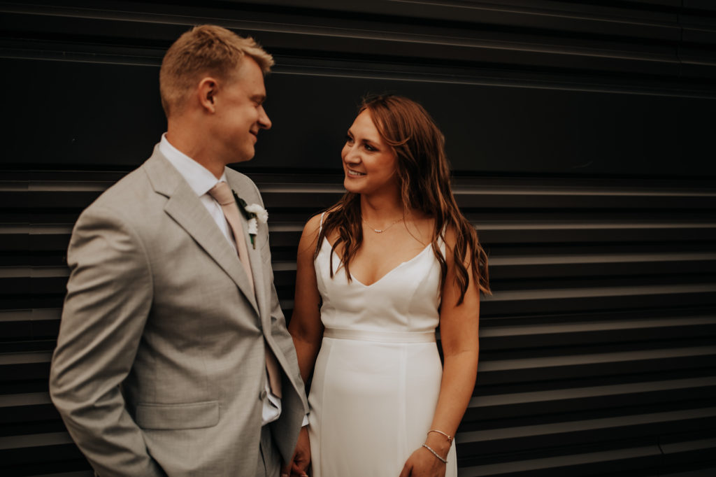 Wedding photo of a couple smiling at each other taken by Dahlia Orchid Photography a Nashville based wedding and elopement photographer