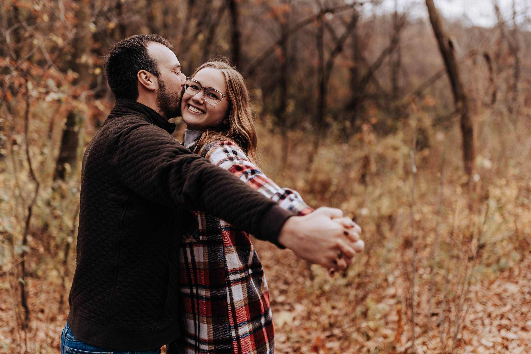 This laid-back, layered look is a great example of how to coordinate flannel and fleece—classic engagement outfit ideas for couples in fall.