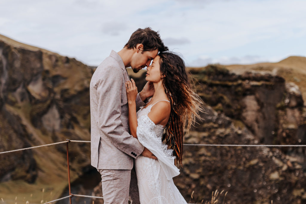 Iceland elopement photographer captures bride and groom embracing after Iceland elopement