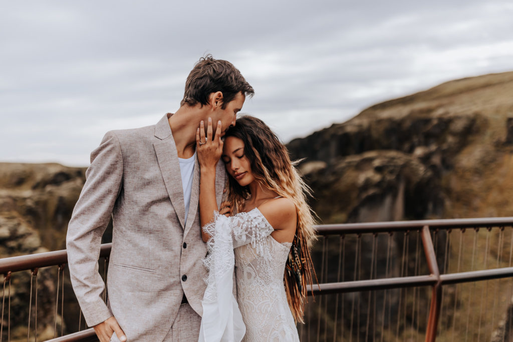 Iceland elopement photographer captures couple on Iceland Cliff after traveling to Iceland to elope