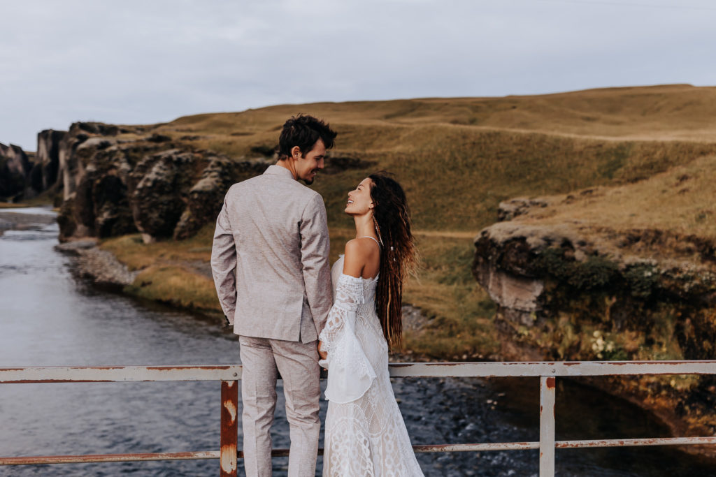 A couple looking into each others eyes. Iceland cliff elopement