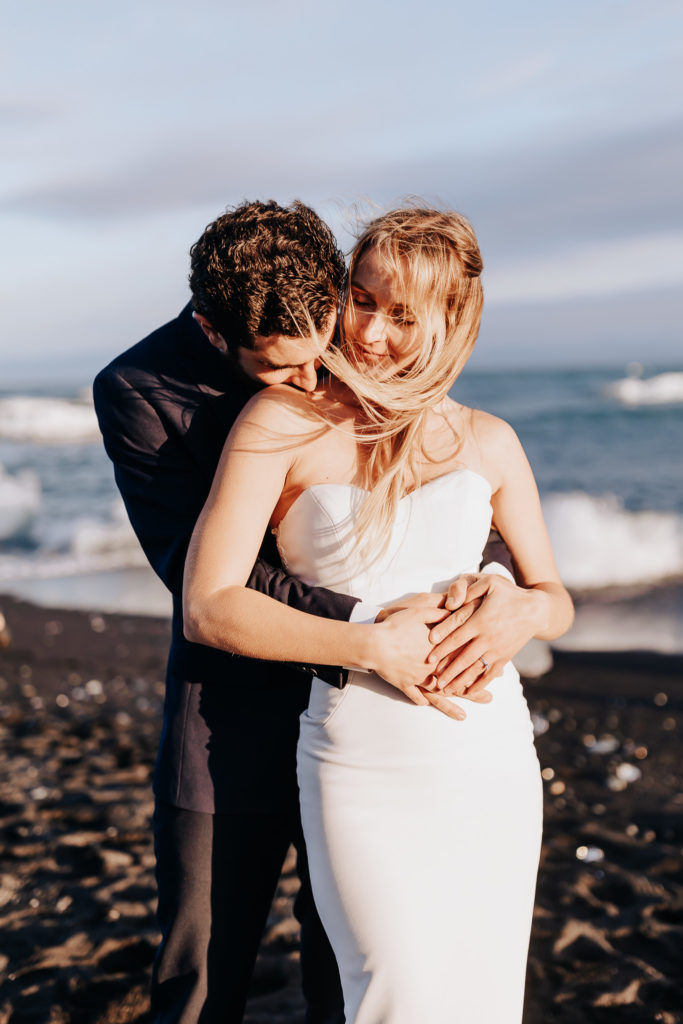 Iceland elopement photographer captures couple embracing during bridal portraits