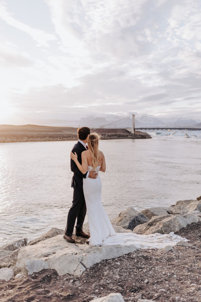 Iceland elopement photographer captures couple standing together at beach