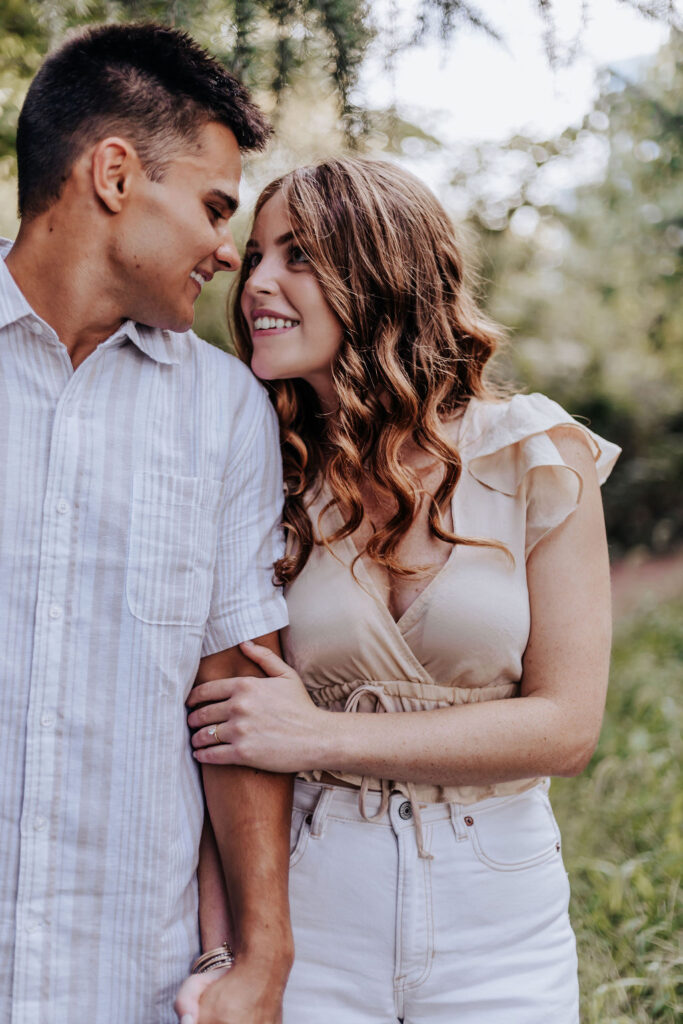 Nashville elopement photographer captures woman holding man's arm during engagements