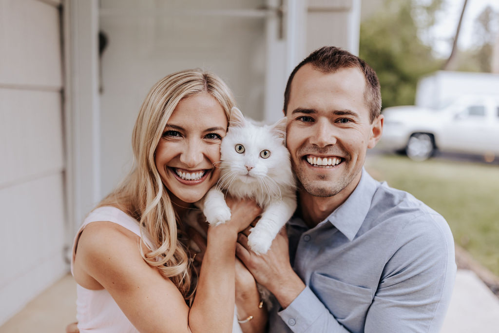 Nashville elopement photographer captures couple holding cat during their at home Nashville engagement photos