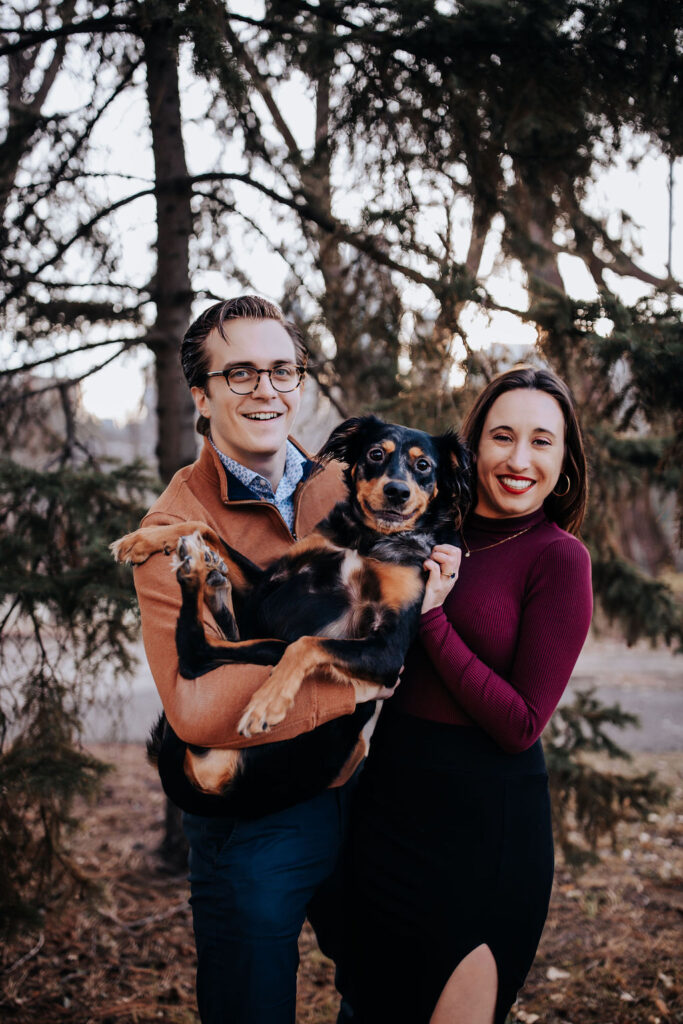 Nashville elopement photographer captures newly engaged couple hugging dog during Nashville engagement photos
