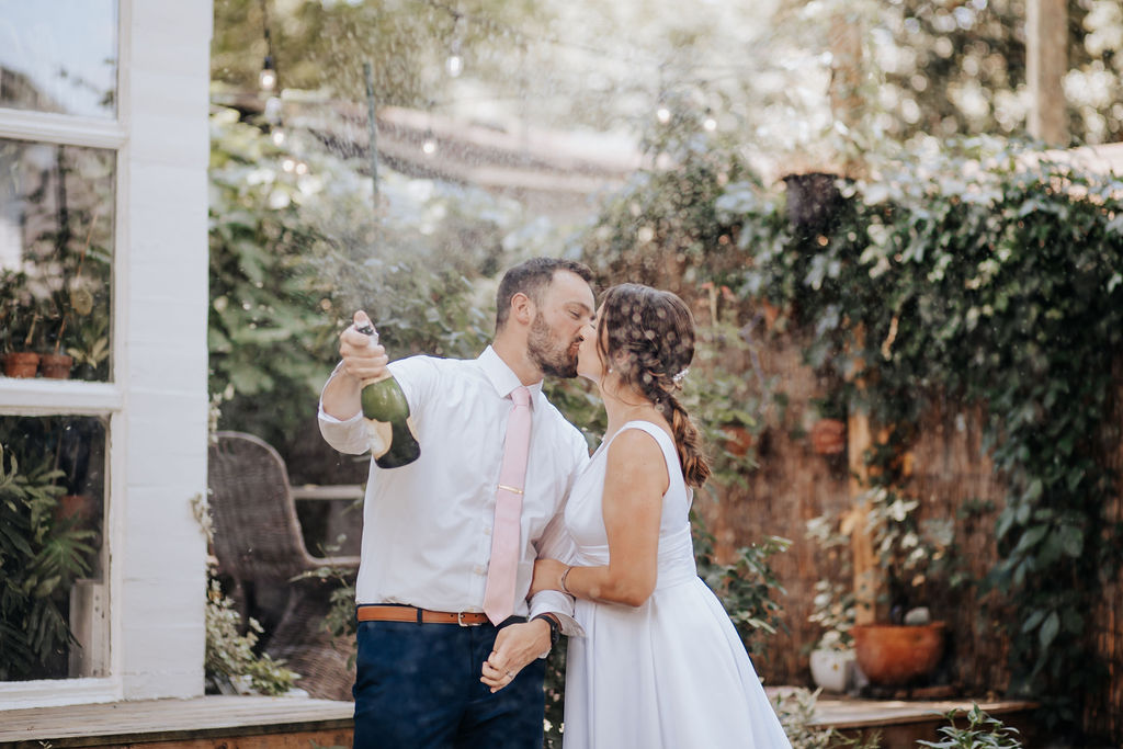 Nashville elopement photographer captures couple celebrating after recent marriage. After they were able to plan a nashville elopement