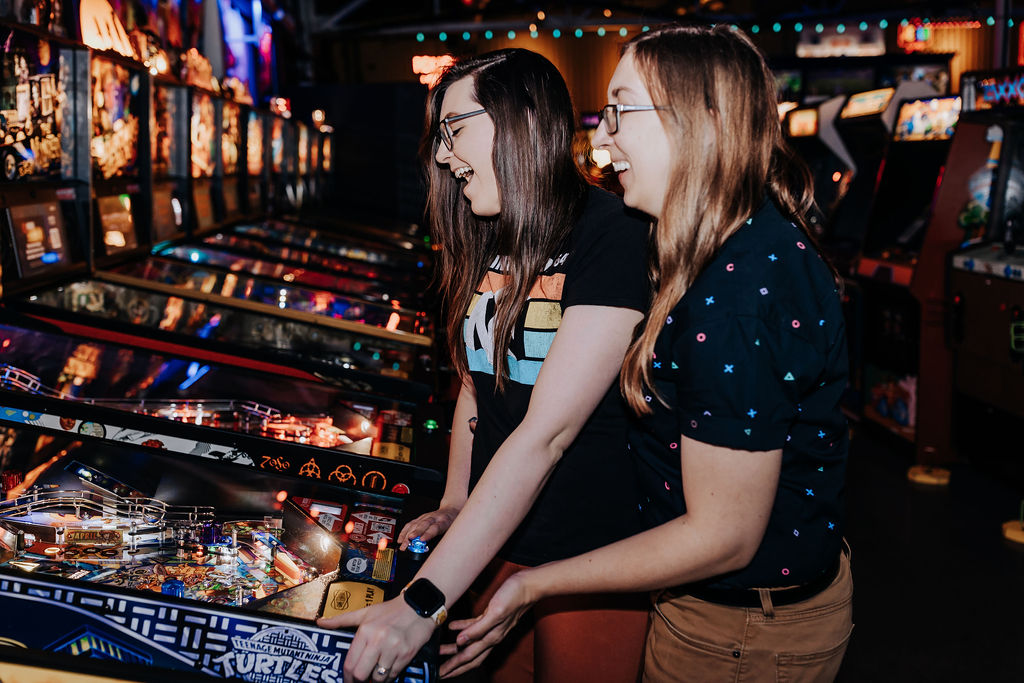 Nashville elopement photographer captures couple playing in arcade together
