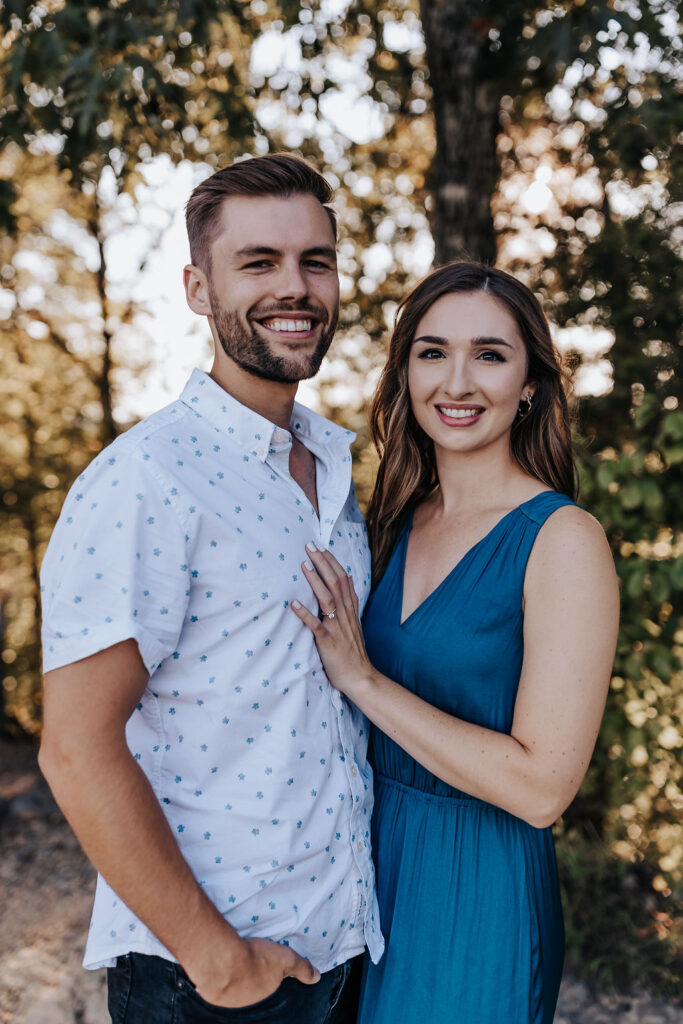 Nashville elopement photographer captures couple standing together wearing coordinating colors for spring engagement outfits
