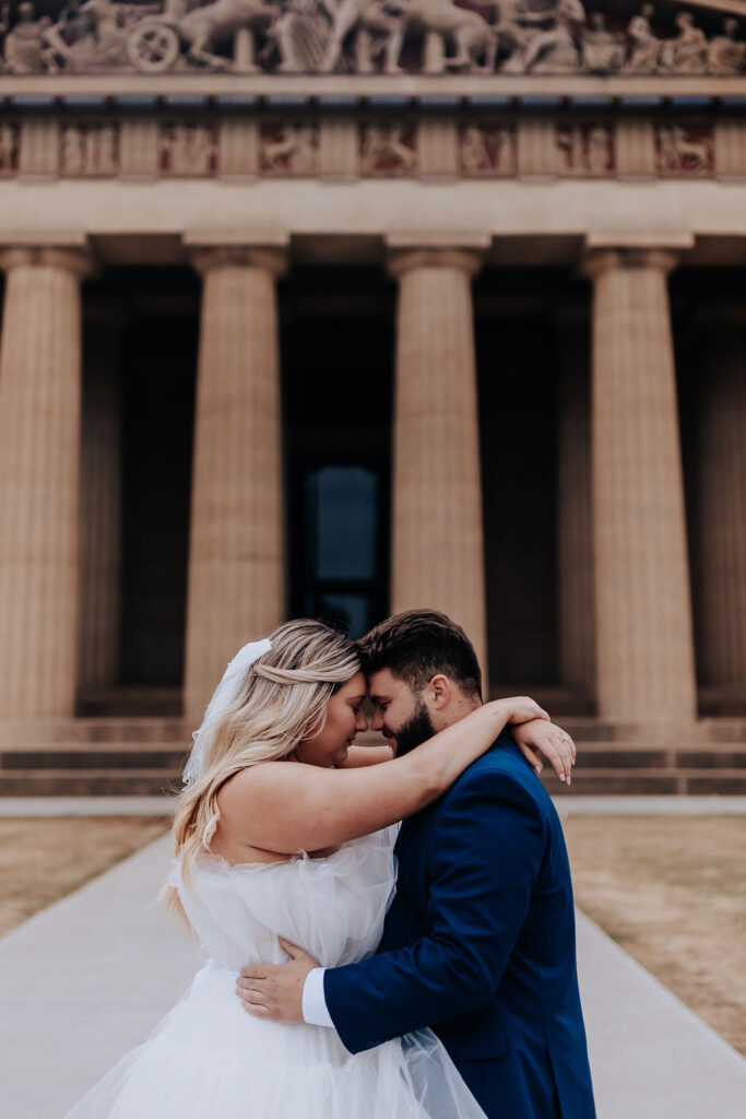 Nashville elopement photographer captures couple hugging with foreheads touching during bridal portraits