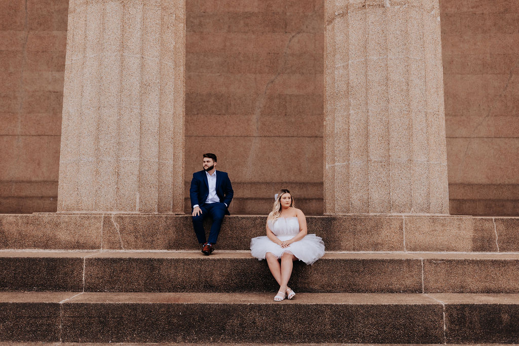 Nashville elopement photographer captures couple sitting on steps in Centennial Park