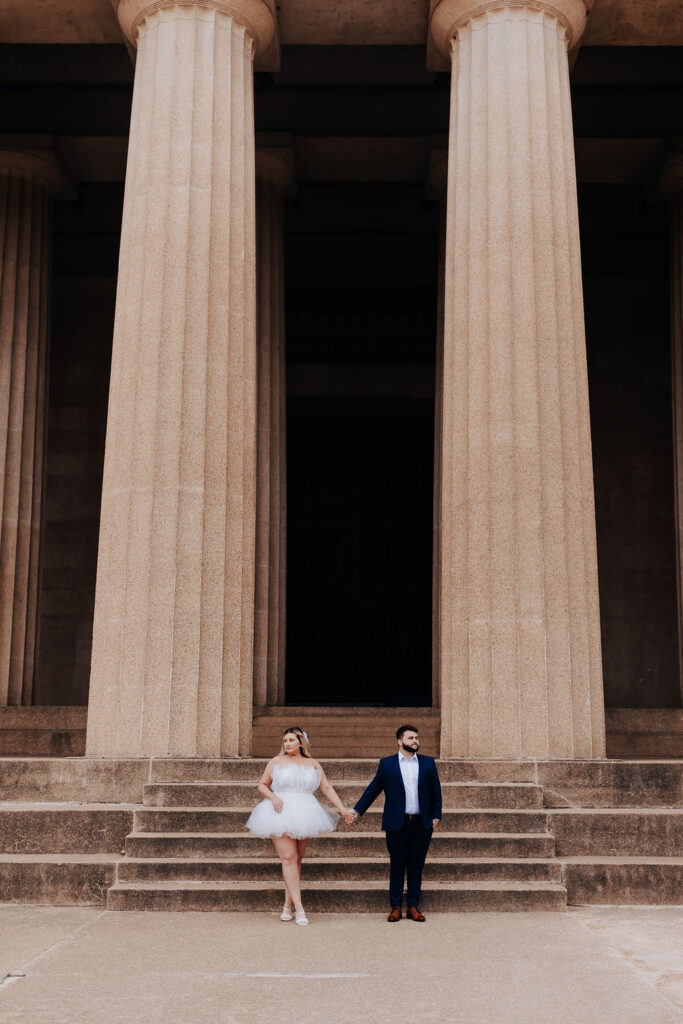 Nashville elopement photographer captures couple holding hands and standing together after intimate elopement in Centennial Park