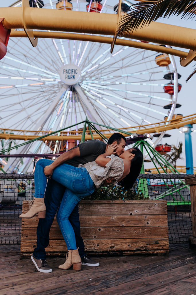 Nashville elopement photographer captures couple kissing in front of ferris wheel