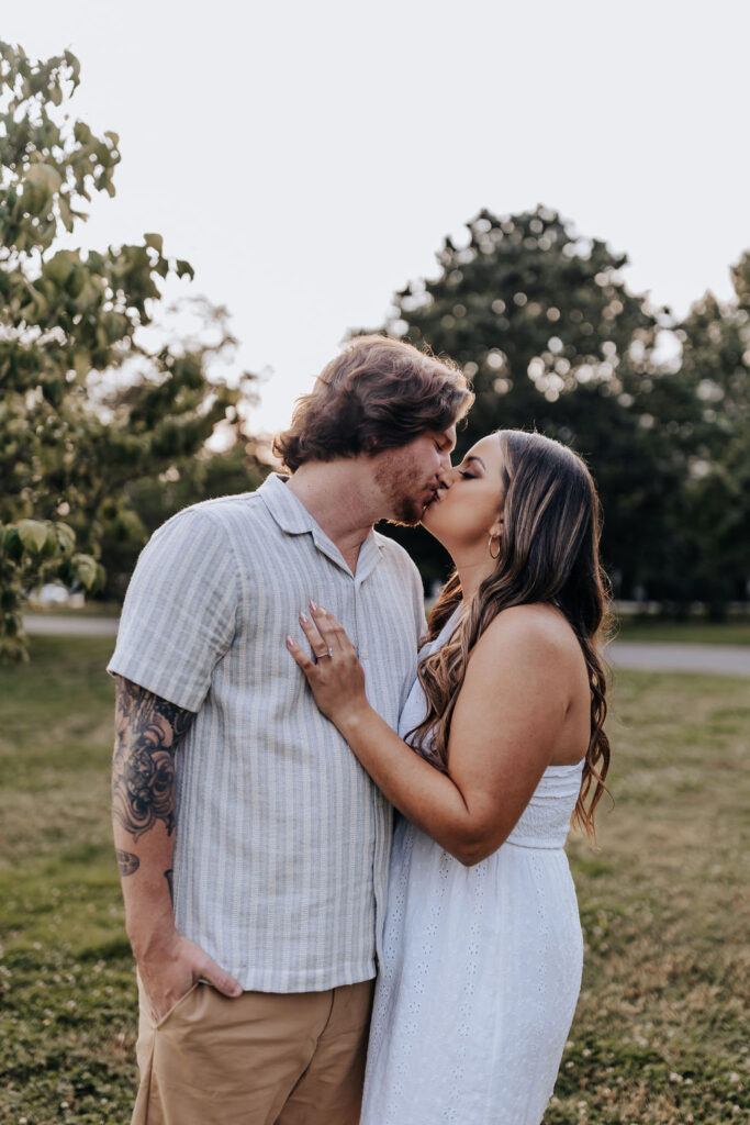 Nashville elopement photographer captures couple kissing during summer engagement photos