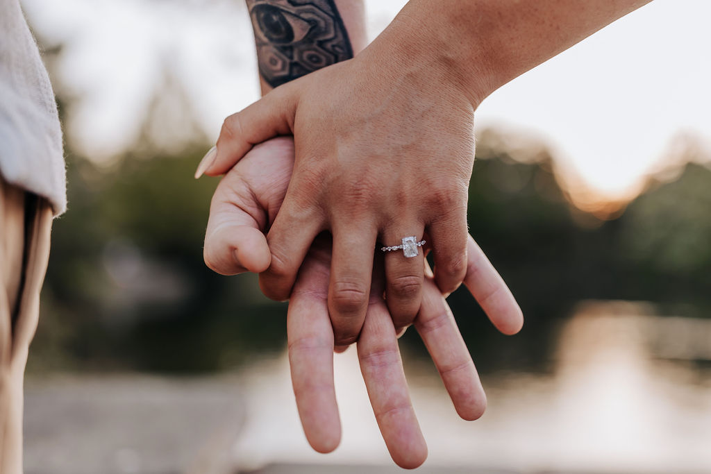 Nashville elopement photographer captures couple holding hands with new engagement ring on woman's finger