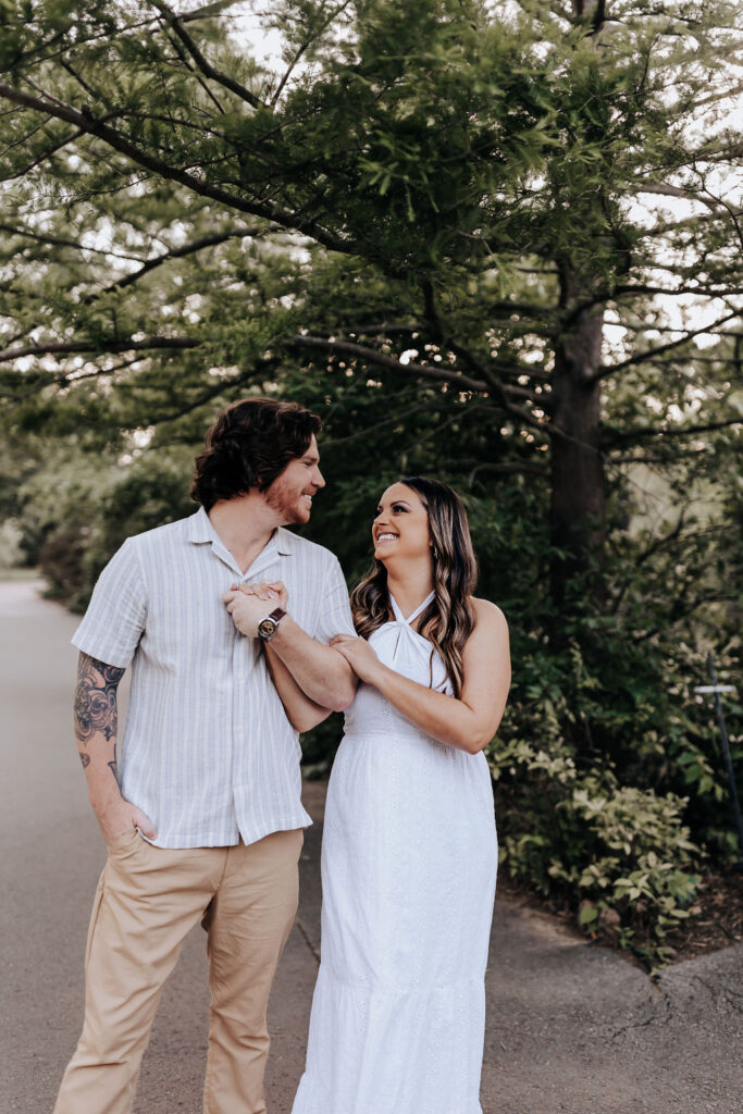Nashville elopement photographer captures couple walking through park holding hands
