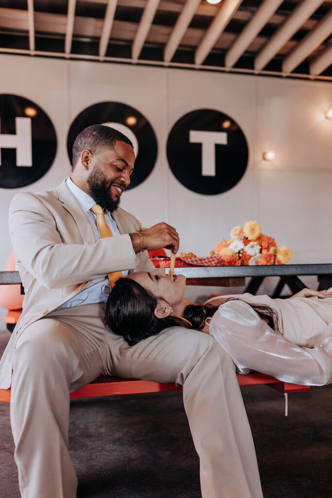 Nashville elopement photographer captures couple eating Hattie B's chicken after elopement
