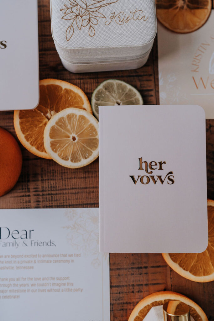 Nashville elopement photographer captures vow books with citrus and invitations