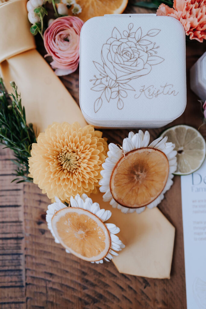 Nashville elopement photographer captures groom details with flowers and invitations