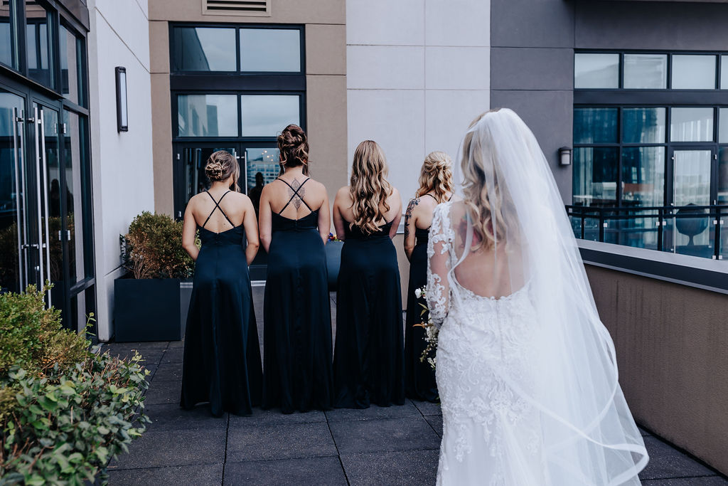 Nashville elopement photographer captures bride having first look with bridesmaids 