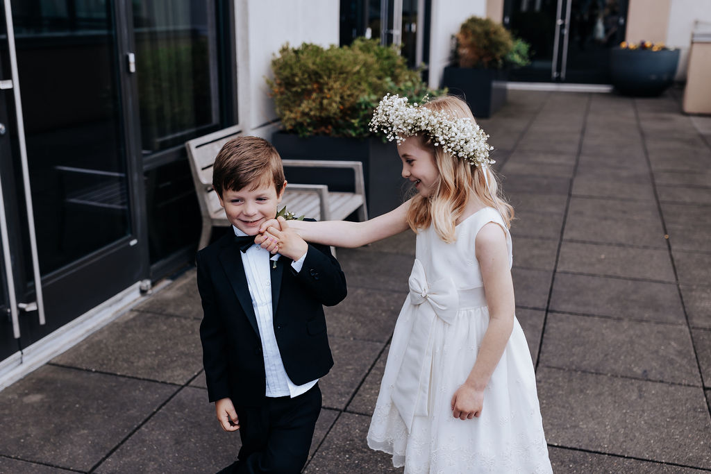 Nashville elopement photographer captures flower girl and ring bearer holding hands and walking together