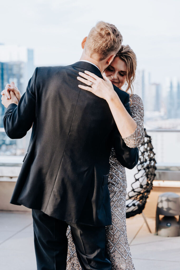 Nashville elopement photographer captures mother son dance at downtown Nashville rooftop wedding