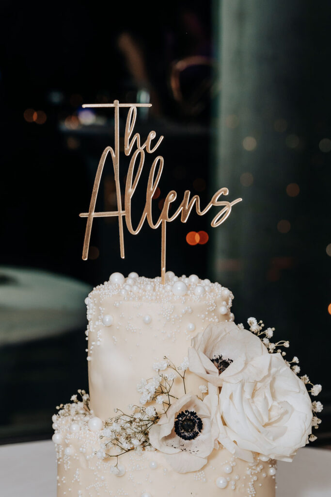 Nashville elopement photographer captures wedding cake with pearls and florals