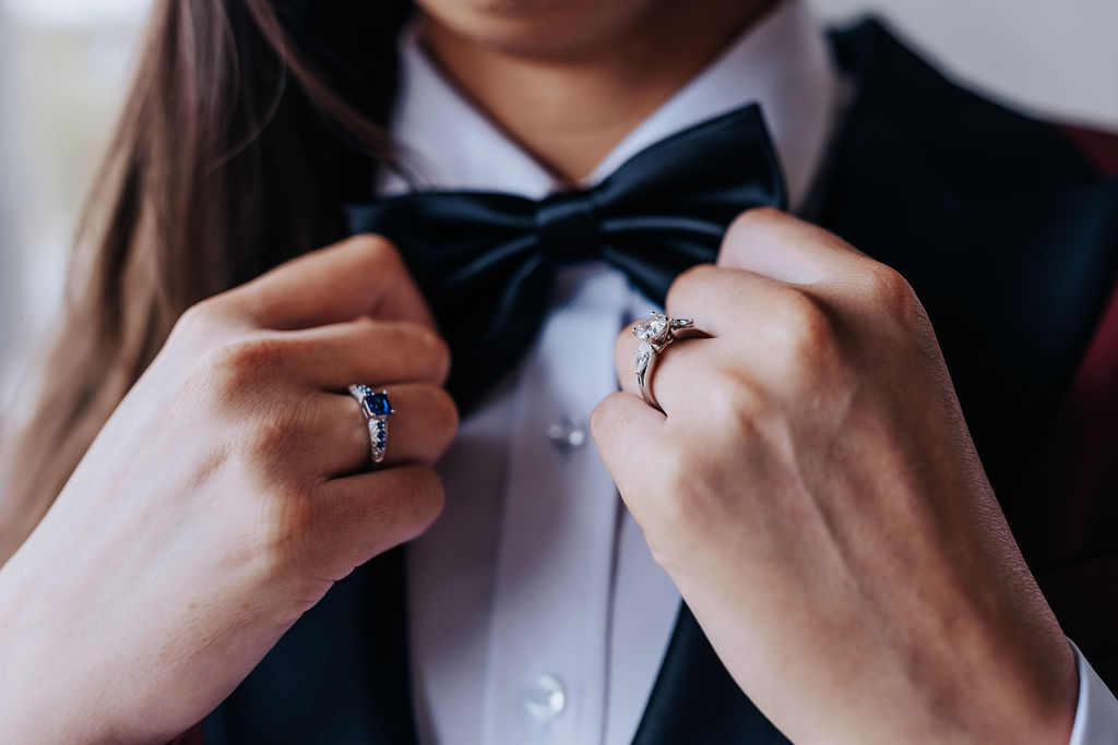 Nashville elopement photographer captures close up of bride adjusting bow tie