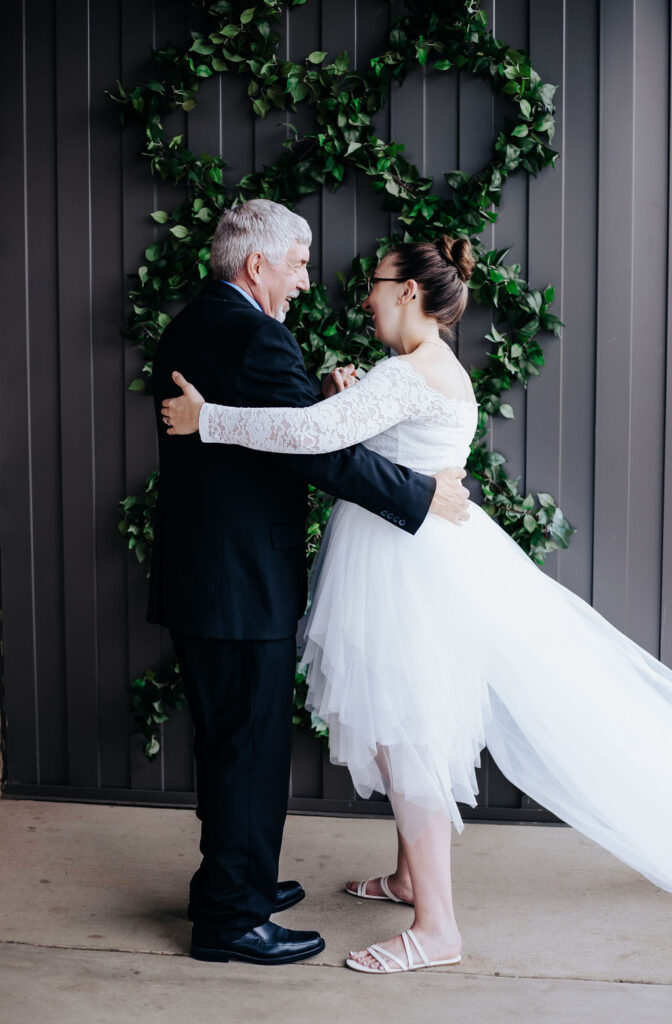 Nashville elopement photographer captures father seeing daughter for first time in wedding attire on wedding day
