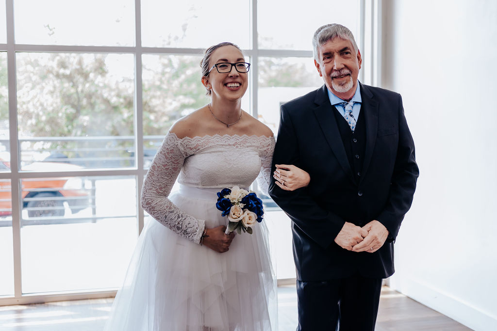 Bride being walked down aisle by father