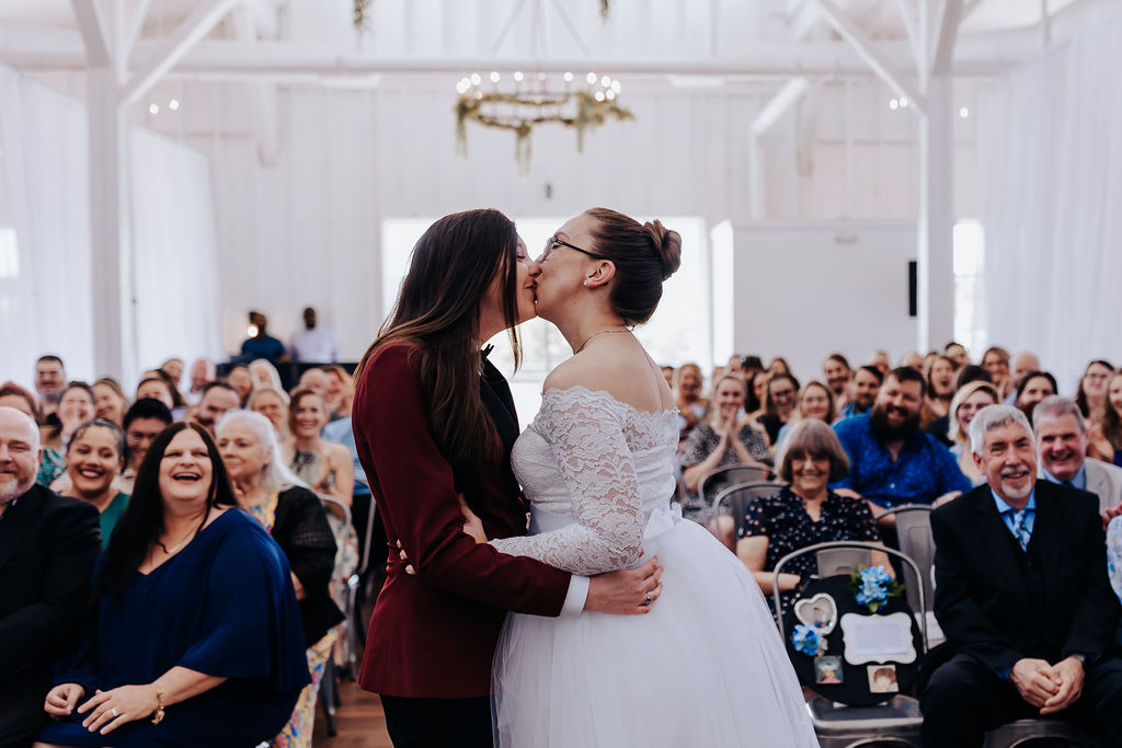 Nashville elopement photographer captures couple kissing as newly married couple at intimate Nashville indoor wedding
