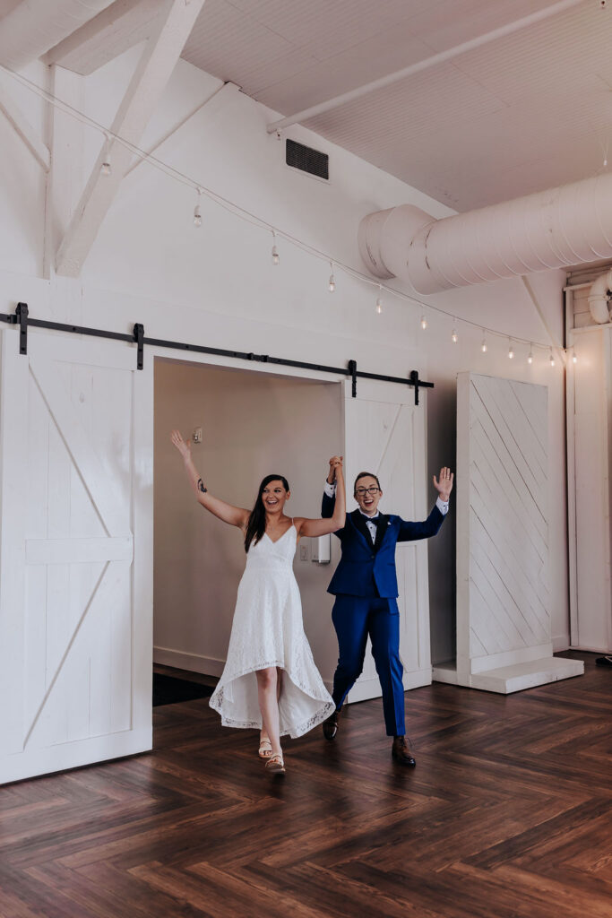 Nashville elopement photographer captures couple walking into reception and celebrating