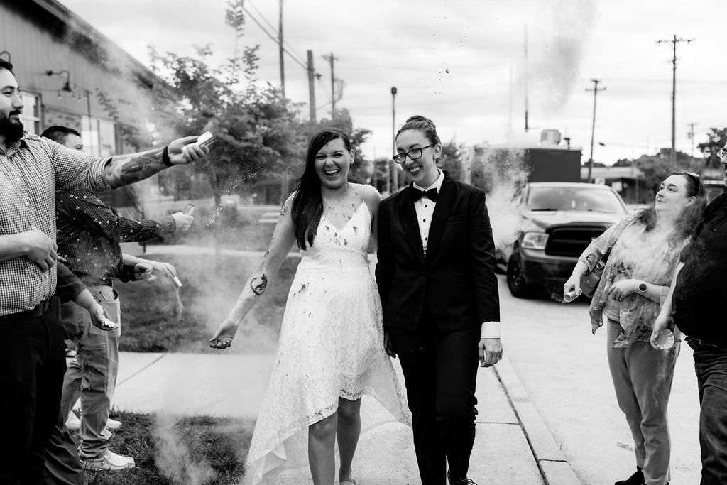Nashville elopement photographer captures black and white portrait of couple walking through wedding exit