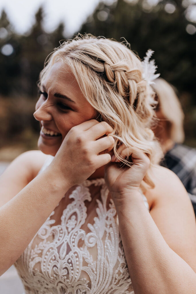 Nashville elopement photographer captures bride putting on earrings