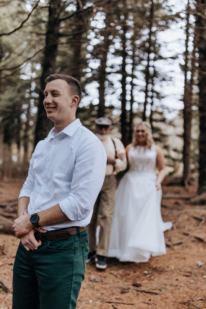 Nashville elopement photographer captures bride walking to groom during first look