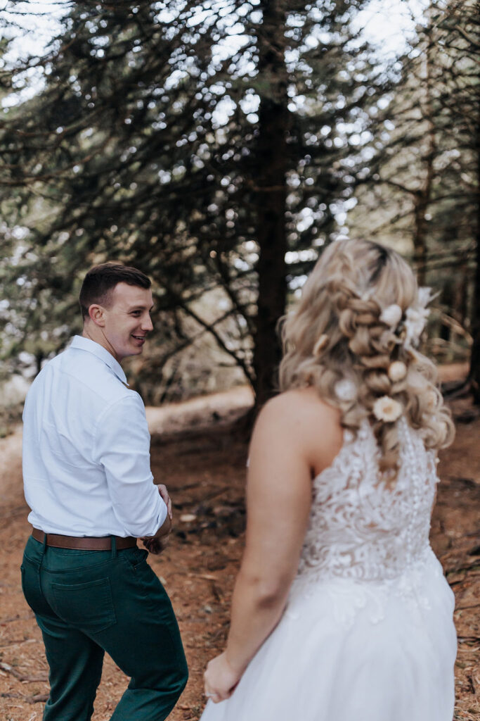 Nashville elopement photographer captures groom turning around to look at bride during first look