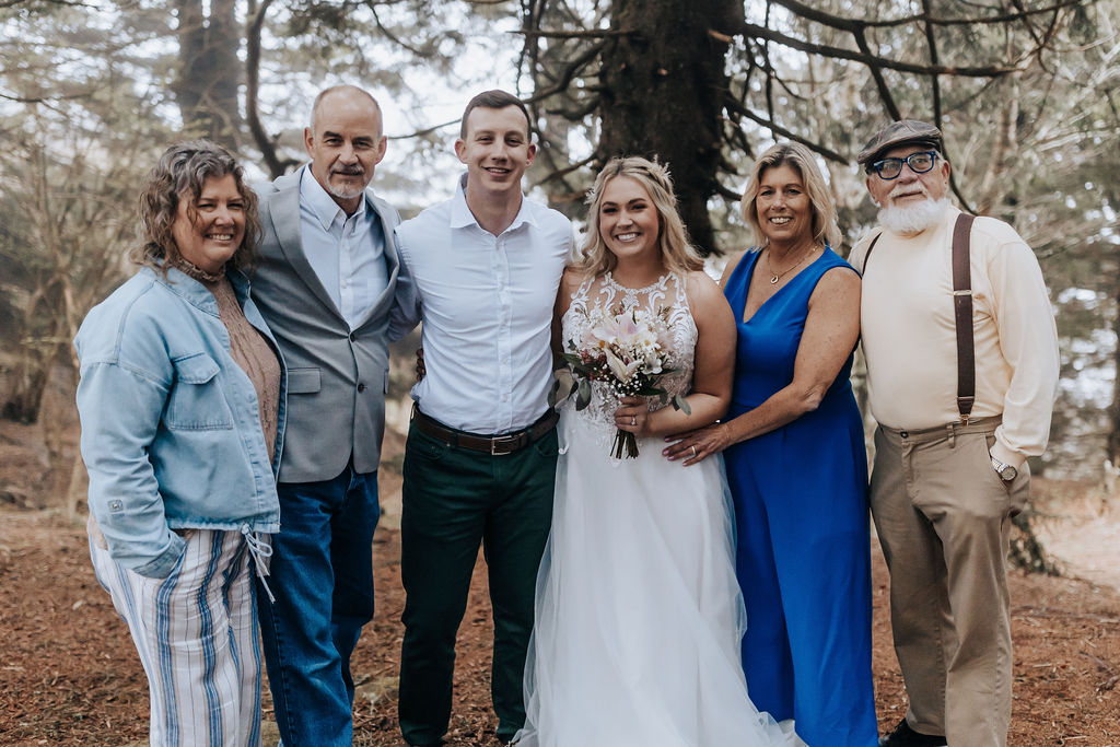 Nashville elopement photographer captures bride and groom with family after Asheville cabin wedding