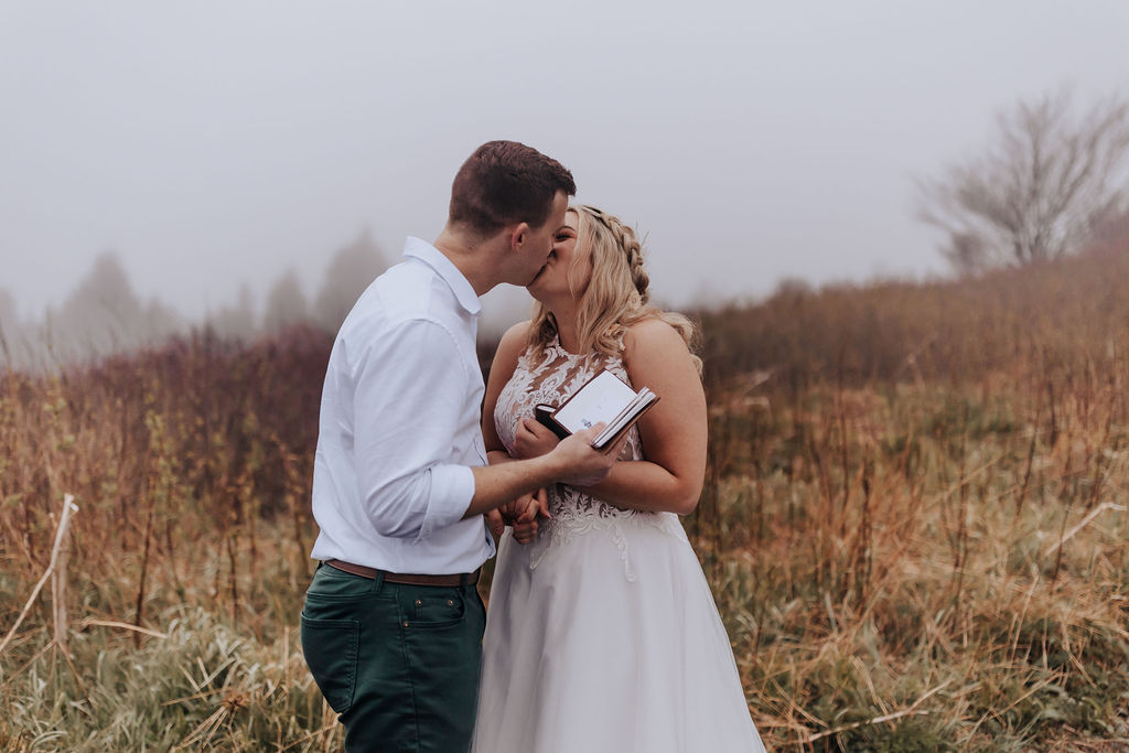 Nashville elopement photographer captures couple kissing after private vow reading
