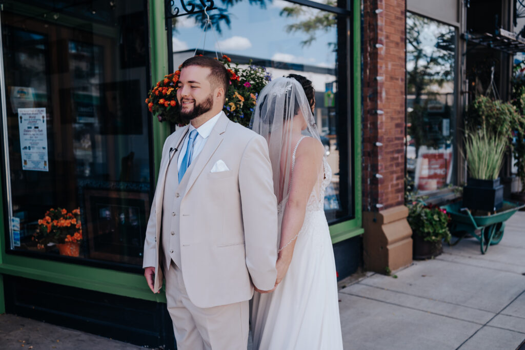 Nashville elopement photographer captures couple back to back holding hands before first look