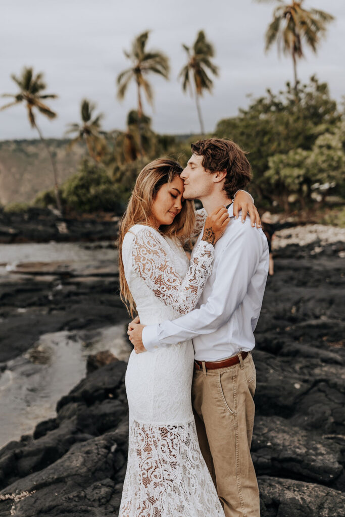 Big Island elopement photographer captures couple hugging on beach