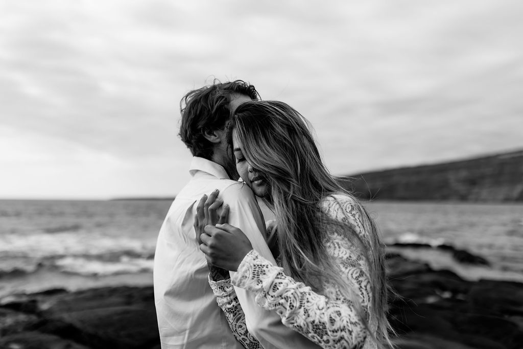 Big Island elopement photographer captures black and white portrait of newly married couple hugging