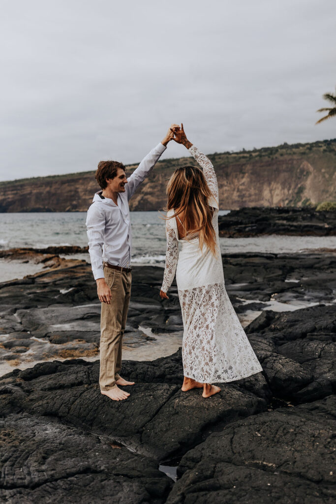 Big Island elopement photographer captures groom spinning bride on beach