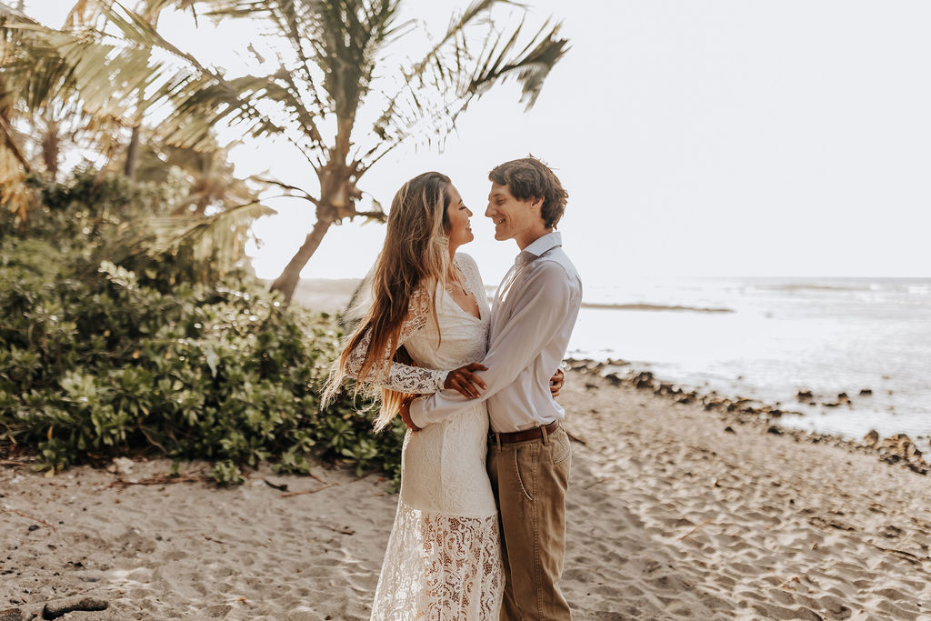 Big Island elopement photographer captures couple embracing on beach after their Big Island Elopement