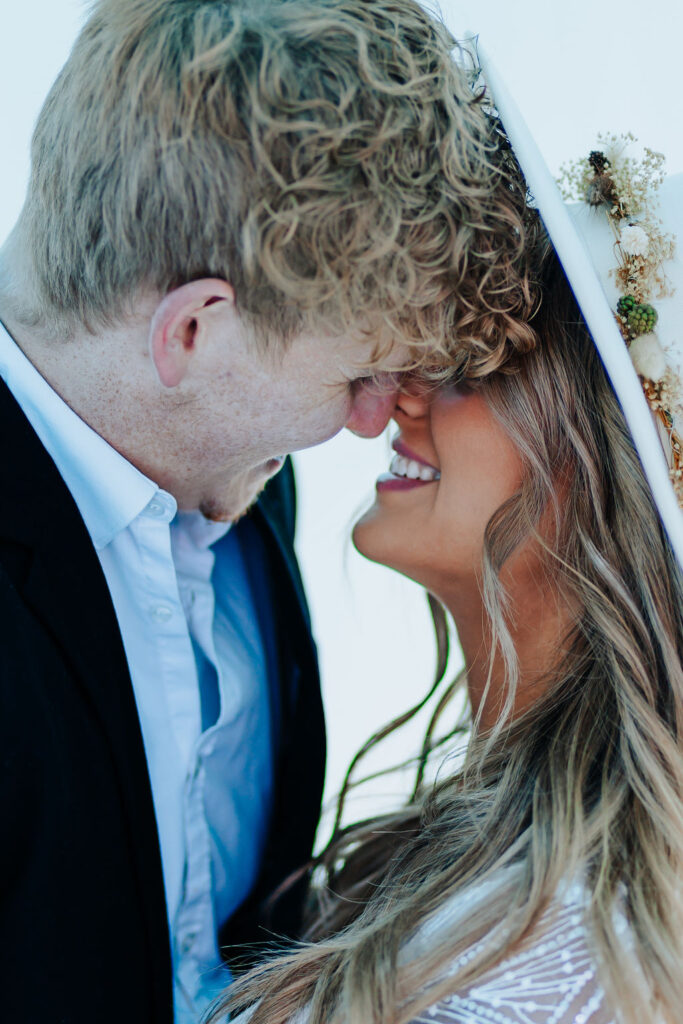 Nashville elopement photographer captures bride and groom kissing during winter engagement photos