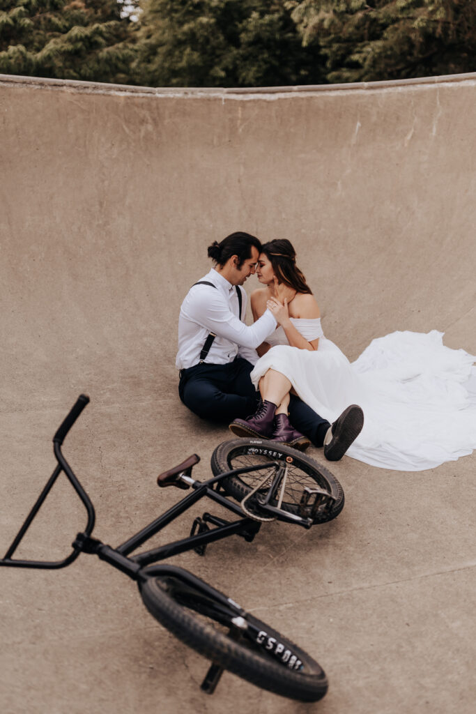 Nashville elopement photographer captures bride and groom kissing at skate park after wedding