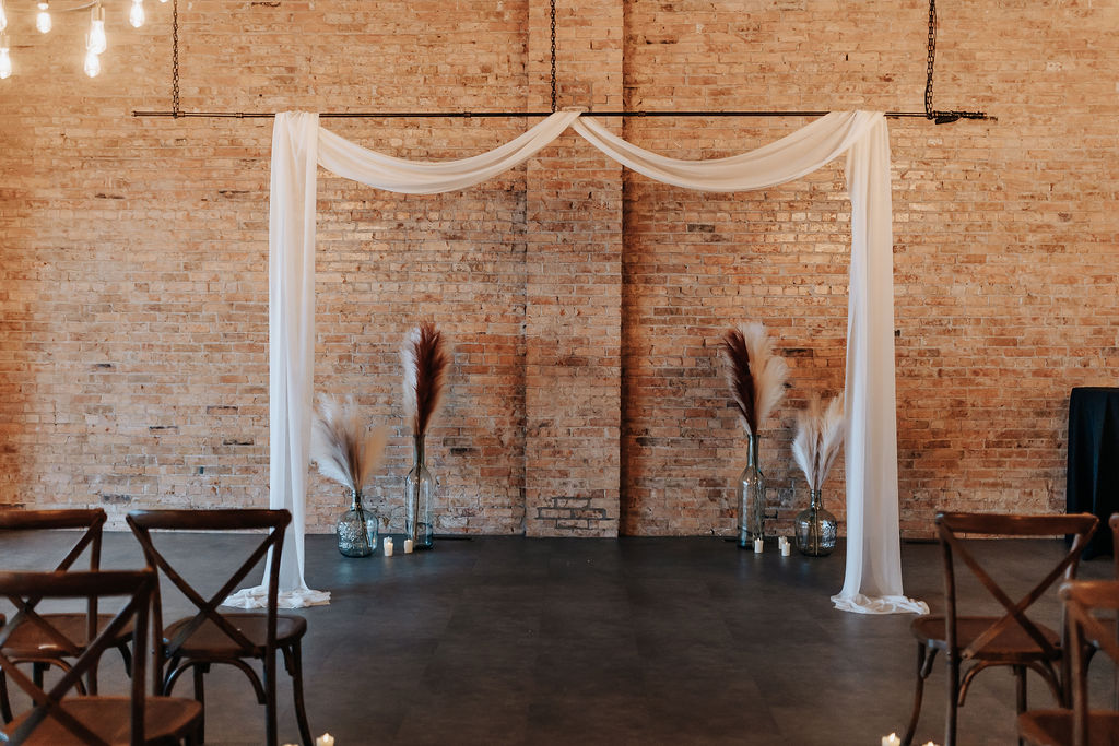 Minneapolis wedding photographer captures indoor wedding ceremony