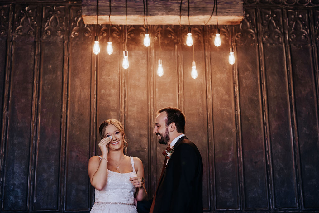 Minneapolis wedding photographer captures couple smiling and laughing during outdoor bridal portraits at the Jerome Event Center