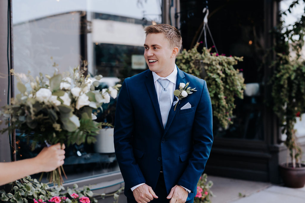 Nashville elopement photographer captures groom smiling at bride during first look