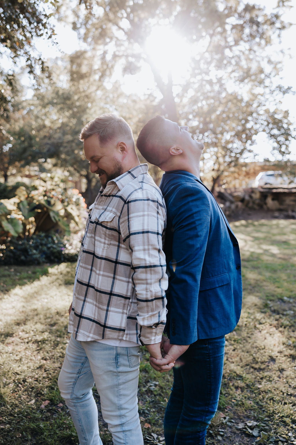 Nashville Elopement Photographer captures couple holding hands back to back during engagement photos