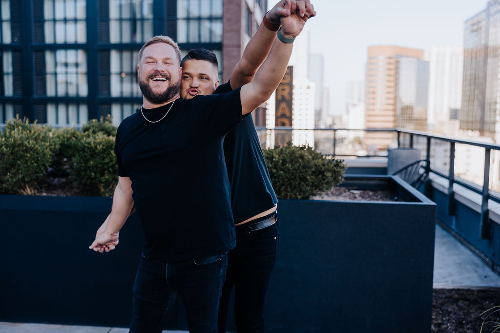 Nashville engagement photographer captures couple holding hands on roof